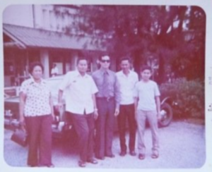 Before the War: (From left) Mrs. Yar, Thawke Yar, Ted Ngoy, Tek Hout Tao, and Bun Tao pose outside the Cambodian Embassy in Thailand in 1974. Three years later, the Yars would be dead, Ted and Bun would be stateless refugees, and Tek would find himself reliving a single day as he struggled to survive in a Khmer Rouge labor camp.