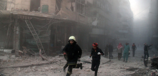Emergency responders rush following a reported barrel bomb attack by government forces in the Al-Muasalat area in the northern Syrian city of Aleppo on November 6, 2014. Syria has asked Russia to speed up delivery of S-300 anti-aircraft missiles, concerned about a possible US attack, Syrian Foreign Minister Walid Muallem said in an interview published Thursday. AFP PHOTO/AMC/TAMER AL-HALABI (Photo credit should read TAMER AL-HALABI/AFP/Getty Images)